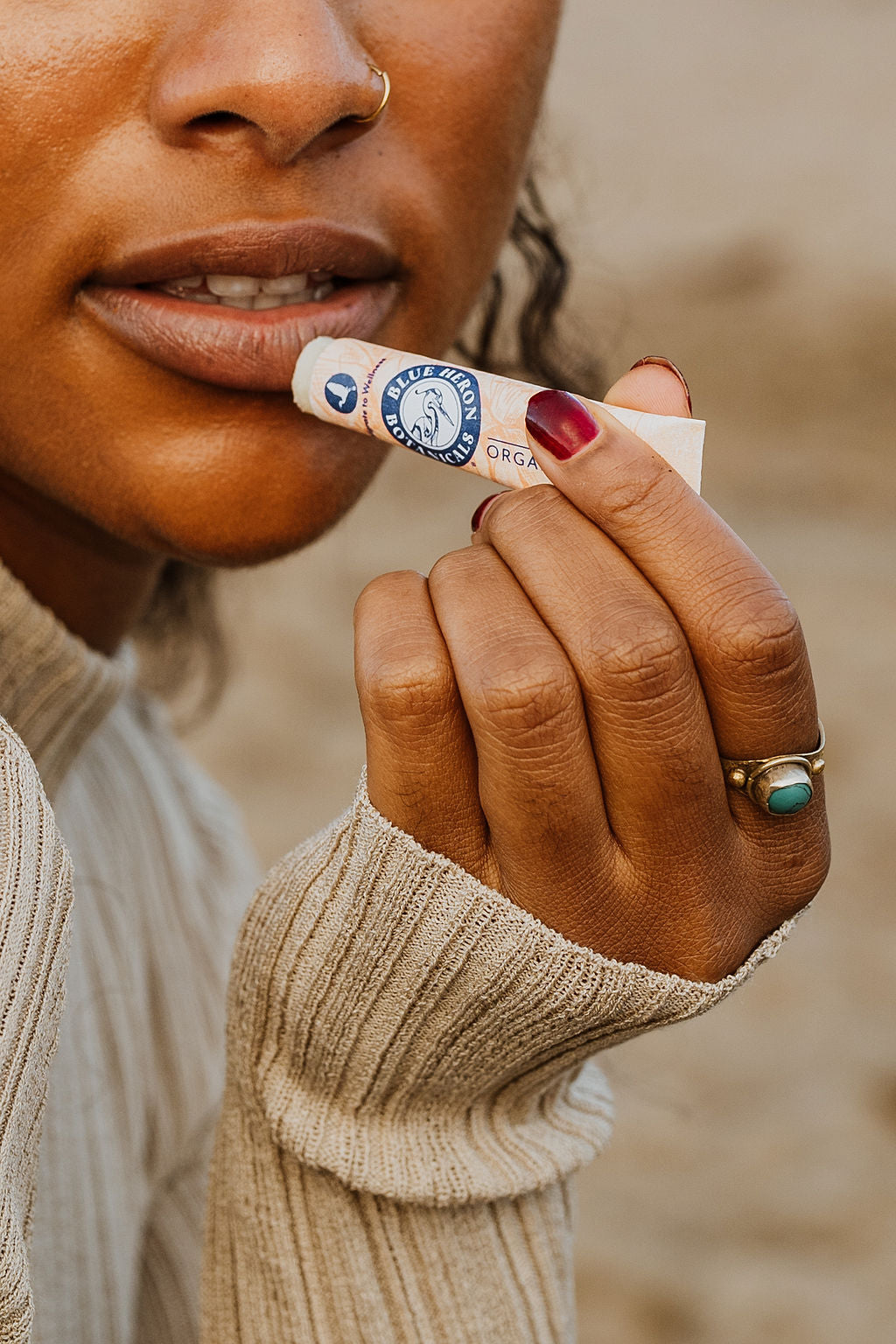 woman applying lip balm